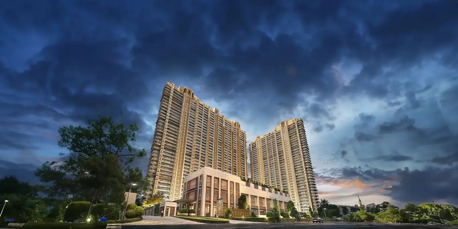 High-rise residential buildings under a dramatic evening sky with dark clouds.